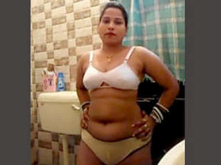 Freshly wedded woman in the restroom