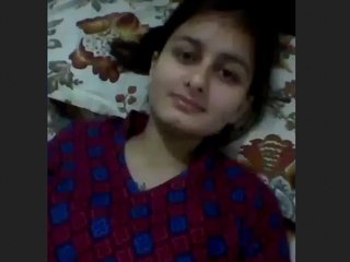 Aroused woman in business attire masturbates her breasts and vagina