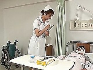Sensual nurse Reiko Sawamura disappears into the background