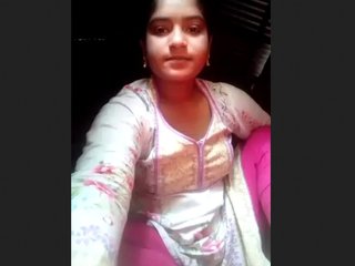 A stunning village woman displays and stimulates herself with her fingers