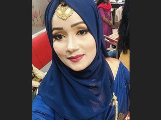 A sultry Indian wife with large breasts engages in passionate oral and vaginal sex in a highly erotic video