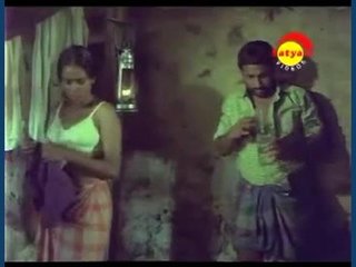 A spouse indulges in playful intimacy with her partner under her husband's supervision