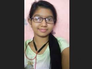 A young Indian woman displays her physique in a sensual recording