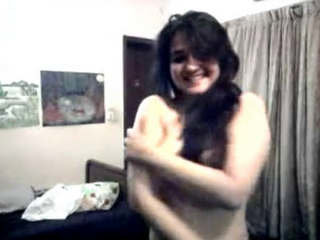 Seductive coed undressing