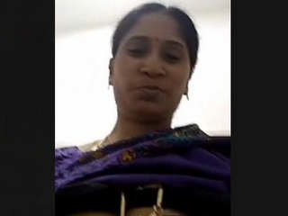 Indian matron displays her breasts during a video chat