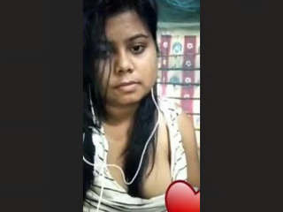 An enticing girl from Assam reveals her breasts and intimate area during a video chat