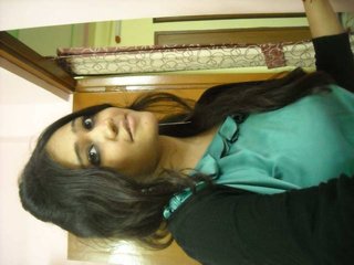 Kiran, an attractive Indian wife, engages in intimate activities with her husband's closest companion in a video recording.