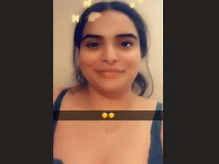 A charming Indian girl from abroad reveals her alluring breasts