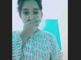 A stunning Asian teen performs in the restroom