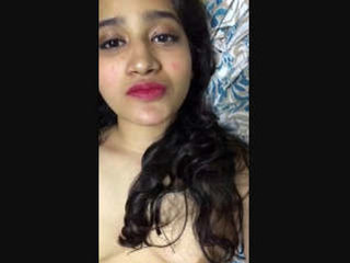 A charming South Asian girlfriend indulges in playful acts for her remote partner