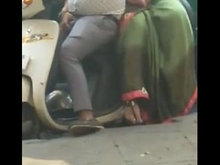 Wife pleasuring husband's penis on scooter