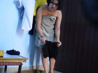 A young Indian woman wears provocative outfits and engages in risqué behavior