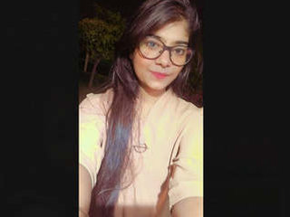 An attractive Indian woman reveals her breasts during a video chat