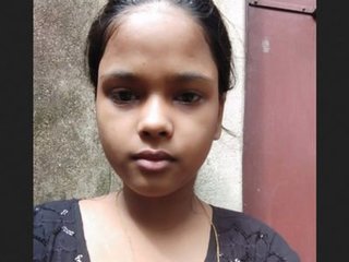 A charming South Asian woman reveals her breasts and intimate area