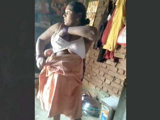 Indian wife dressed in village setting filmed by spouse