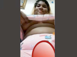 Attractive girlfriend displays her large breasts over video call