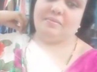 Fatty Indian woman flaunts her large breasts and tight pussy in saree