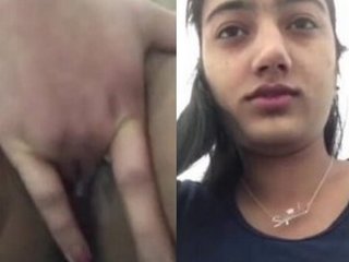 Young girl pleasures herself with her fingers in a sensual solo video