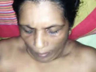 Mature woman giving a handjob and receiving cum on her breasts