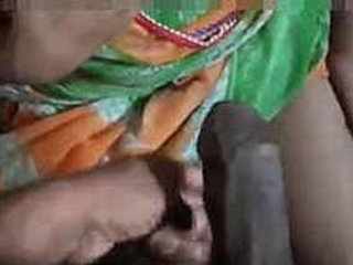 Indian aunt gives a handjob and gets a facial