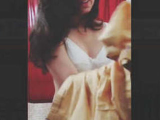A cute desi girl gets naked for her lover in a video