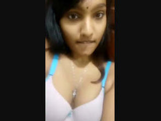 Pretty Tamil girl flaunts her body in a seductive manner