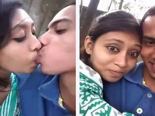 College co-eds share a passionate kiss in the park