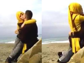 Muslim couple shares a romantic moment with a kiss