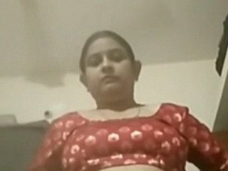 Watch a stunning Indian bhabhi strip nude and show off her breasts