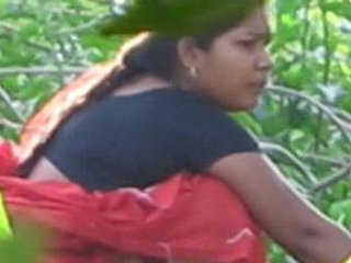 A hidden camera captures a Desi woman urinating in public