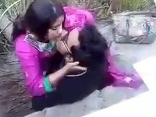 Couple shares passionate kisses in the great outdoors