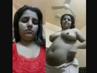 Indian girl pleasures herself with her hands in front of camera