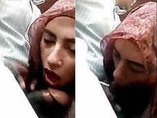 Arab woman gives oral pleasure in car with hijab